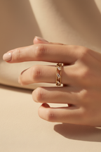 Bezel Glow Ring open band ring lifestyle shot worn on model against neutral background, ZARIÉ fine jewellery LUMIÈRE collection