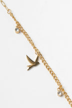 Bird Charm Bracelet – Gold delicate bracelet champagne gold-tone on clean white background, product flat lay, ZARIÉ fine jewellery SÉRÉNITÉ collection