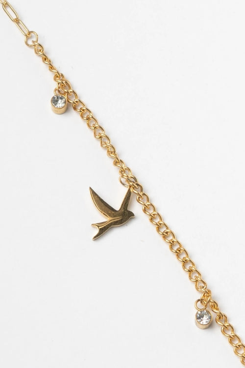 Bird Charm Bracelet – Gold delicate bracelet champagne gold-tone on clean white background, product flat lay, ZARIÉ fine jewellery SÉRÉNITÉ collection