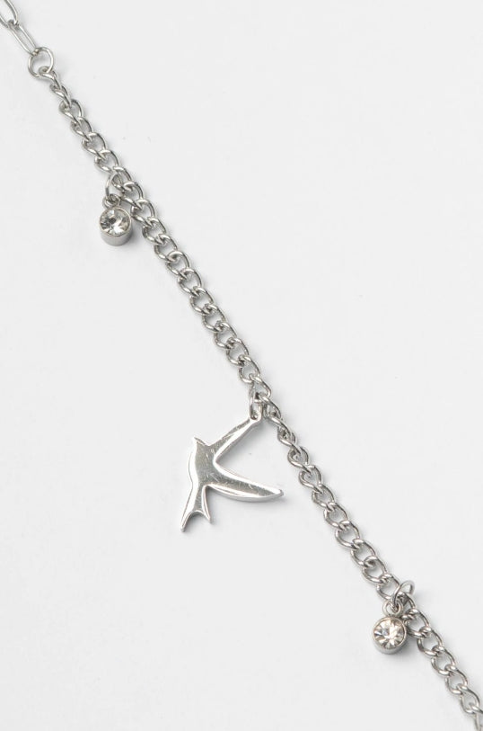 Bird Charm Bracelet- Silver delicate bracelet silver-tone on clean white background, product flat lay, ZARIÉ fine jewellery ÉLORA collection