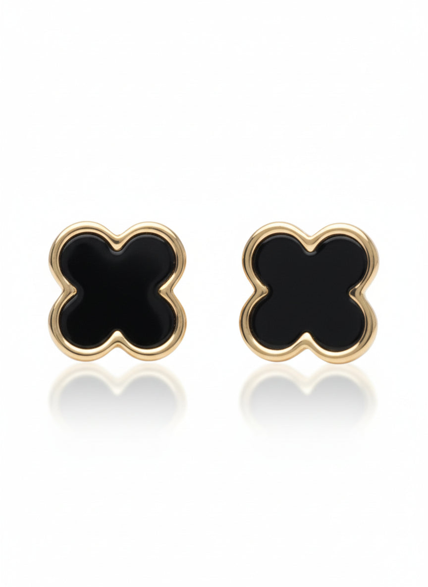 Pair of black clover-shaped earrings with gold outlines on a white background