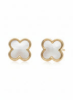 Pair of champagne gold four-leaf clover stud earrings with white mother-of-pearl inlay centres photographed on soft white background, showing polished metallic finish, symmetrical clover design with four rounded petals, and delicate refined craftsmanship