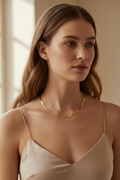 Contour Chain Necklace — Shortline fine chain necklace lifestyle shot worn on model against neutral background, ZARIÉ fine jewellery HARMONIE collection