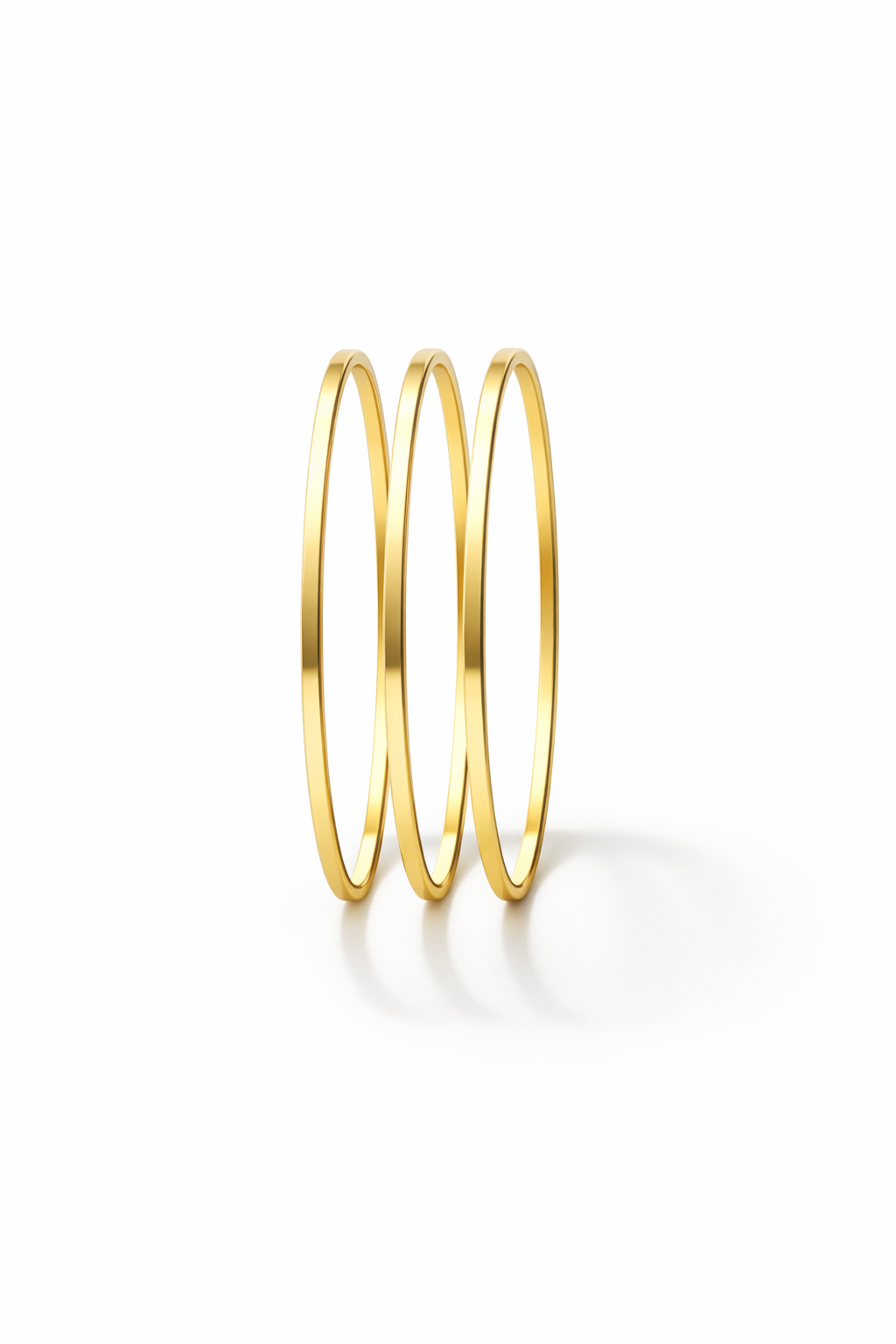 Contour Trio Bangles — Gold fine jewellery piece champagne gold-tone on clean white background, product flat lay, ZARIÉ fine jewellery SÉRÉNITÉ collection