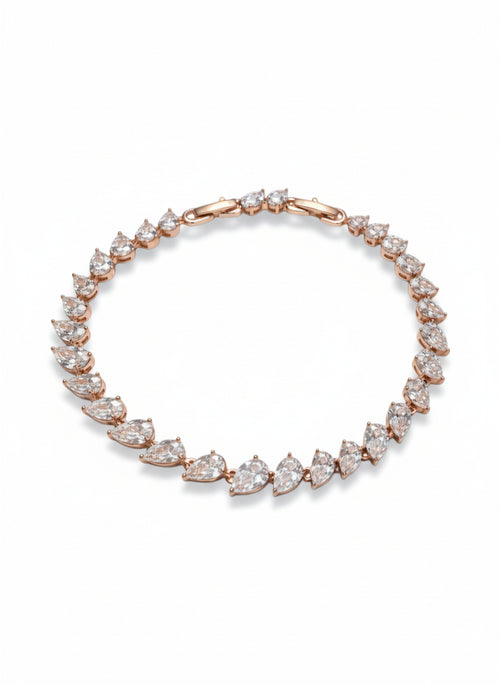 Crossed Teardrop Line Bracelet drop earrings on clean white background, product flat lay, ZARIÉ fine jewellery LUMIÈRE collection