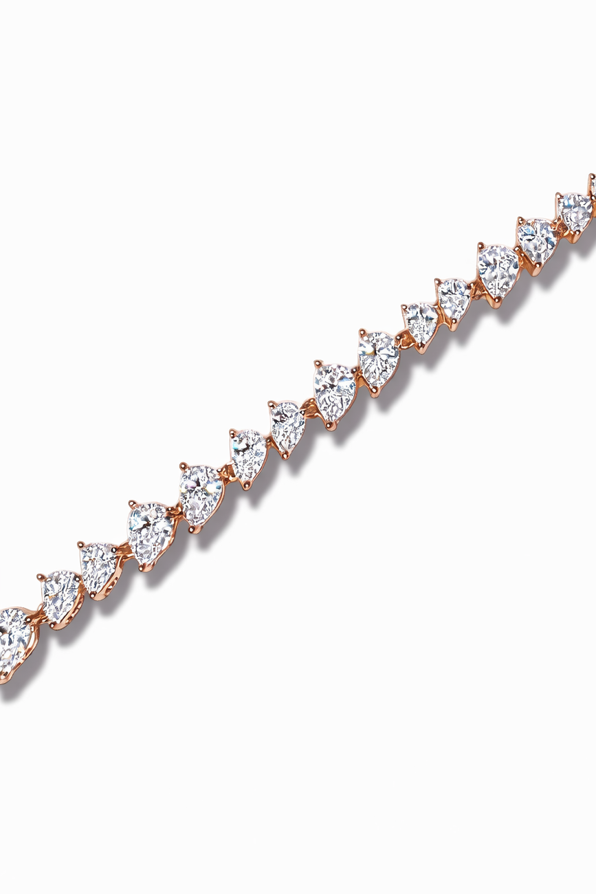 Crossed Teardrop Line Bracelet drop earrings on clean white background, product flat lay, ZARIÉ fine jewellery LUMIÈRE collection