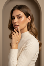 Crown Light Handpiece fine jewellery piece lifestyle shot worn on model against neutral background, ZARIÉ fine jewellery LUMIÈRE collection