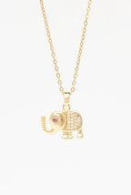 Elephant Crest Necklace — Gold fine chain necklace champagne gold-tone lifestyle shot worn on model against neutral background, ZARIÉ fine jewellery LUMIÈRE collection