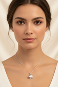 Elephant Crest Necklace — Silver fine chain necklace silver-tone lifestyle shot worn on model against neutral background, ZARIÉ fine jewellery ÉLORA collection
