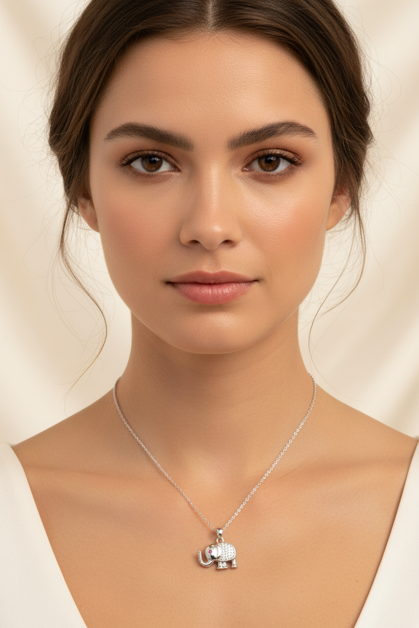 Elephant Crest Necklace — Silver fine chain necklace silver-tone lifestyle shot worn on model against neutral background, ZARIÉ fine jewellery ÉLORA collection