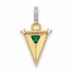 Gold pendant with a green gemstone on a white background