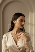 Faceted Triangle Charm Pendant pendant necklace lifestyle shot worn on model against neutral background, ZARIÉ fine jewellery RAYONNE collection