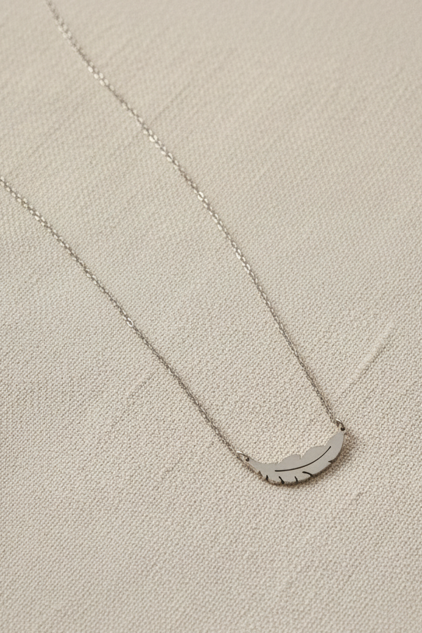 Feather Line Necklace fine chain necklace on clean white background, product flat lay, ZARIÉ fine jewellery ÉLORA collection