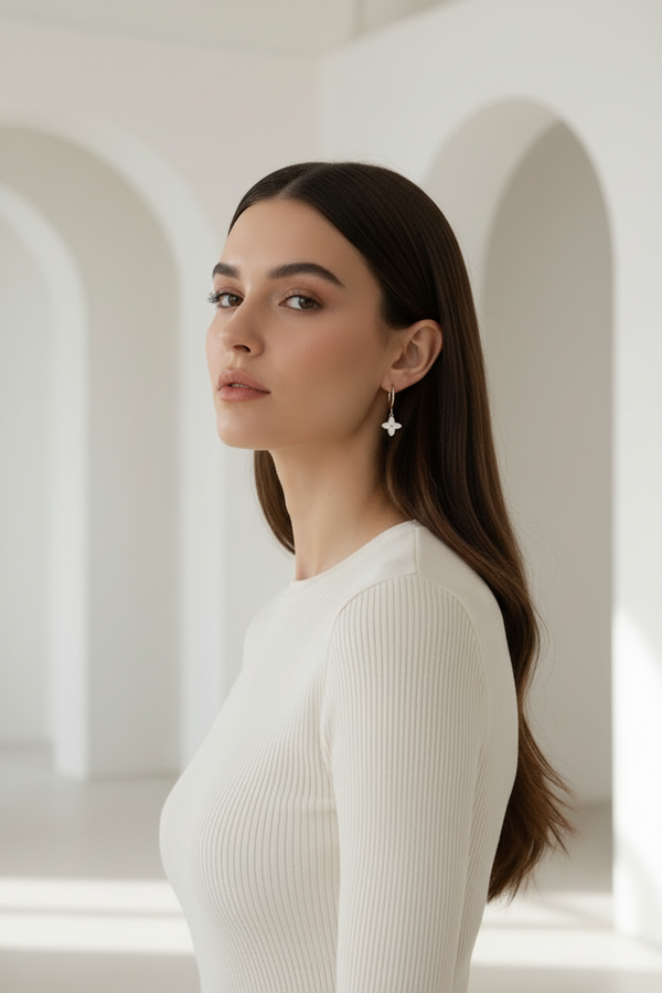 Four-Petal Hoop Earrings – Silver hoop earrings silver-tone lifestyle shot worn on model against neutral background, ZARIÉ fine jewellery ÉLORA collection