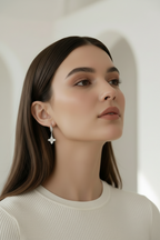 Four-Petal Hoop Earrings – Silver hoop earrings silver-tone lifestyle shot worn on model against neutral background, ZARIÉ fine jewellery ÉLORA collection