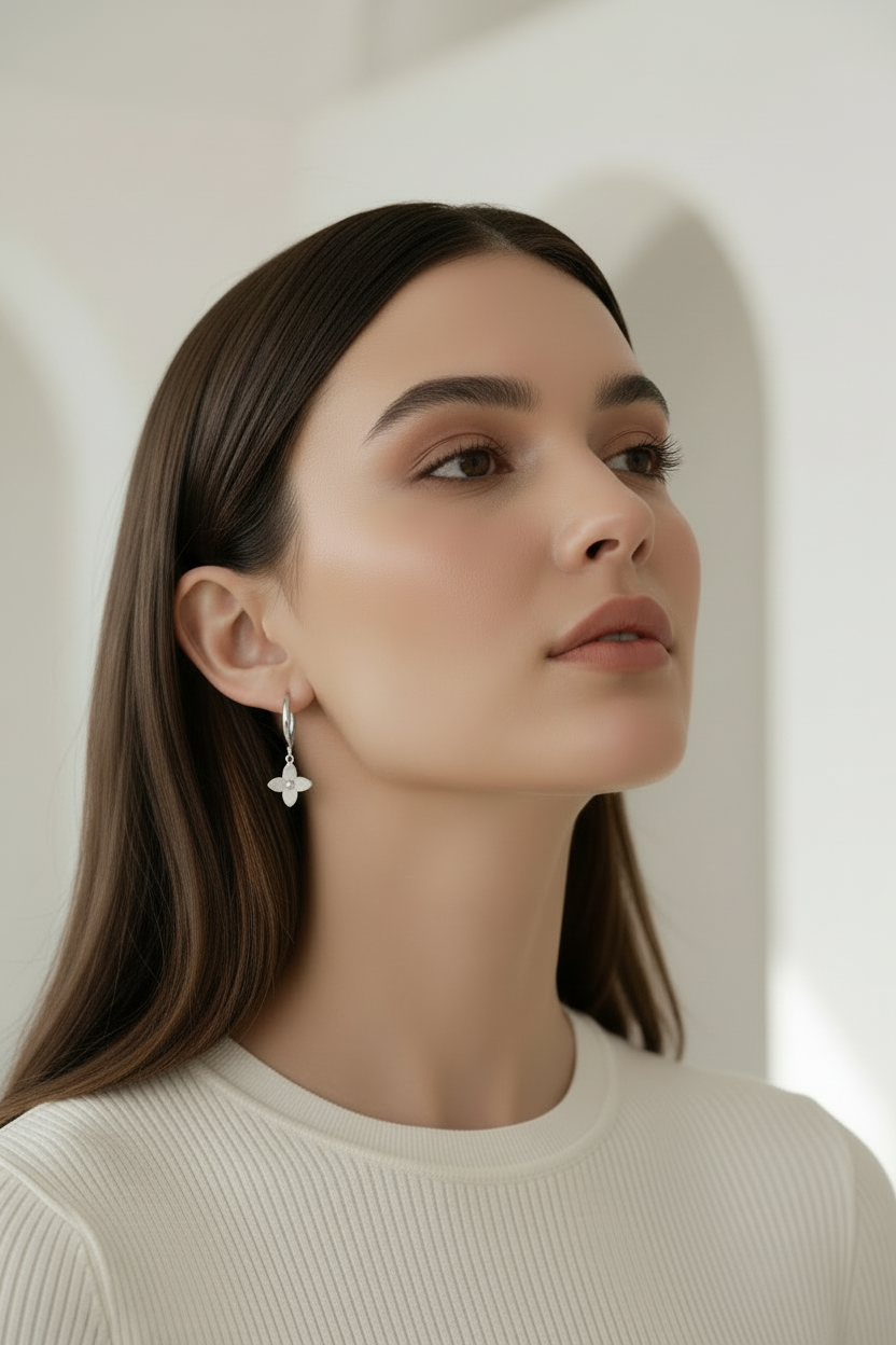 Four-Petal Hoop Earrings – Silver hoop earrings silver-tone lifestyle shot worn on model against neutral background, ZARIÉ fine jewellery ÉLORA collection