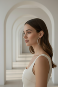 Full Pavé Hoop Earrings — Silver hoop earrings silver-tone with pavé stone setting lifestyle shot worn on model against neutral background, ZARIÉ fine jewellery ÉLORA collection