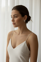 Giola Halo Hoops hoop earrings lifestyle shot worn on model against neutral background, ZARIÉ fine jewellery LUMIÈRE collection