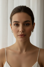 Giola Halo Hoops hoop earrings lifestyle shot worn on model against neutral background, ZARIÉ fine jewellery LUMIÈRE collection
