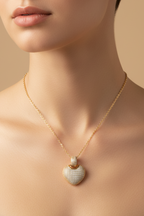 Heart Crest Necklace — Silver fine chain necklace silver-tone lifestyle shot worn on model against neutral background, ZARIÉ fine jewellery AMOURÉ collection
