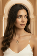 Heart Fringe Necklace — Gold fine chain necklace champagne gold-tone lifestyle shot worn on model against neutral background, ZARIÉ fine jewellery AMOURÉ collection