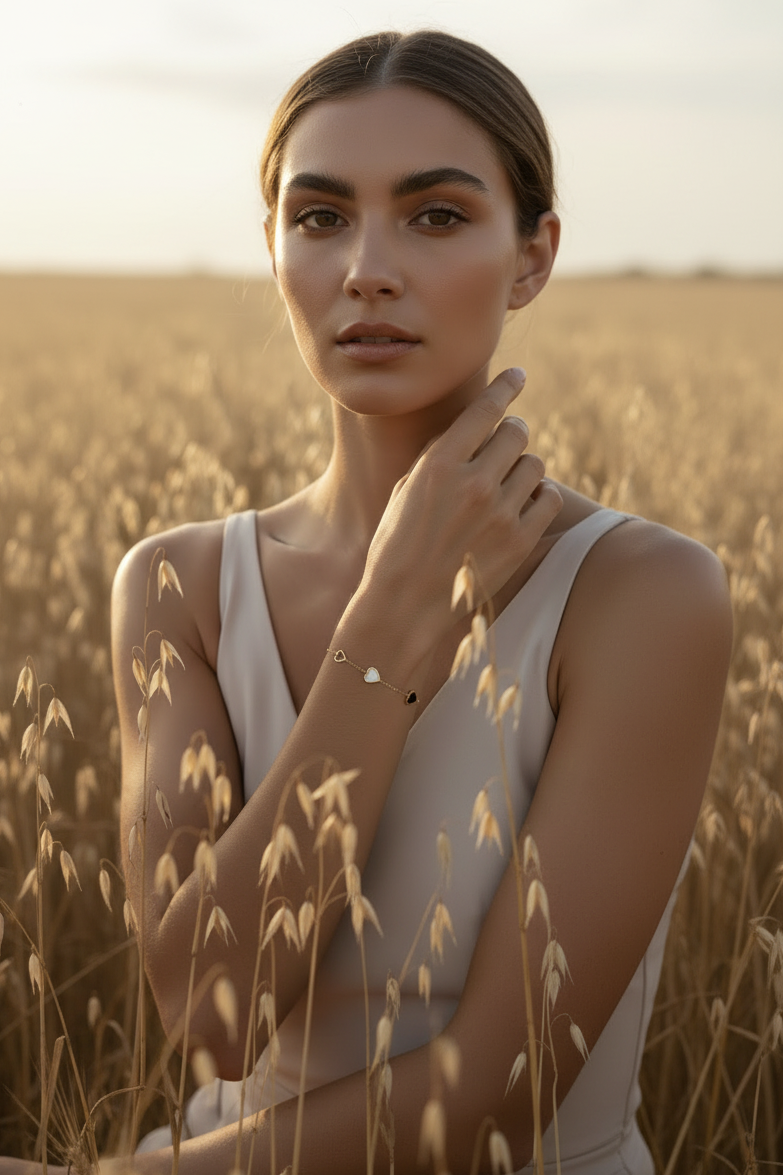 Heart Motif Chain Bracelet fine chain necklace lifestyle shot worn on model against neutral background, ZARIÉ fine jewellery SÉRÉNITÉ collection