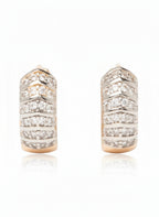 Pair of diamond hoop earrings on a white background