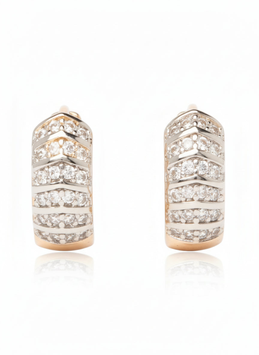 Pair of diamond hoop earrings on a white background