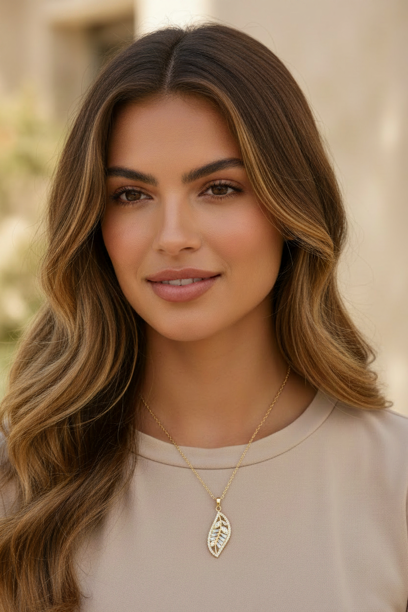 Leaf Silhouette Necklace — Gold fine chain necklace champagne gold-tone lifestyle shot worn on model against neutral background, ZARIÉ fine jewellery LUMIÈRE collection