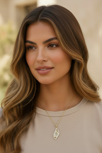 Leaf Silhouette Necklace — Gold fine chain necklace champagne gold-tone lifestyle shot worn on model against neutral background, ZARIÉ fine jewellery LUMIÈRE collection