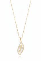 Leaf Silhouette Necklace — Gold fine chain necklace champagne gold-tone lifestyle shot worn on model against neutral background, ZARIÉ fine jewellery LUMIÈRE collection