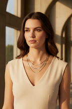 Lustre Grand Necklace fine chain necklace lifestyle shot worn on model against neutral background, ZARIÉ fine jewellery HARMONIE collection