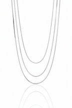 Lustre Trio Necklace fine chain necklace lifestyle shot worn on model against neutral background, ZARIÉ fine jewellery ÉLORA collection