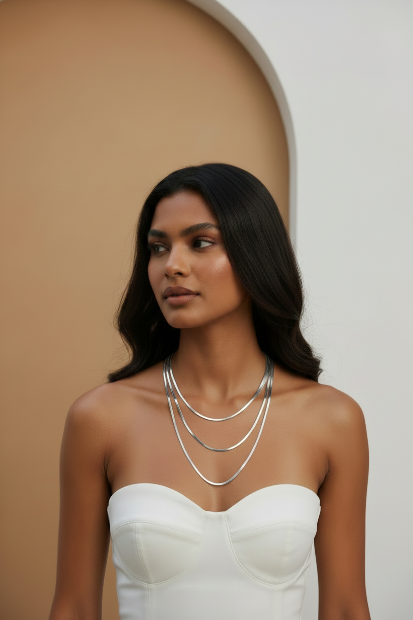 Lustre Trio Necklace fine chain necklace lifestyle shot worn on model against neutral background, ZARIÉ fine jewellery ÉLORA collection