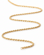 Lustre Twist Chain — Gold fine chain necklace champagne gold-tone lifestyle shot worn on model against neutral background, ZARIÉ fine jewellery SÉRÉNITÉ collection