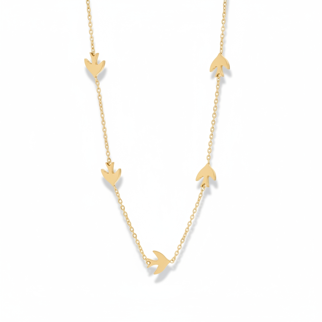 Gold necklace with bird pendants on a white background