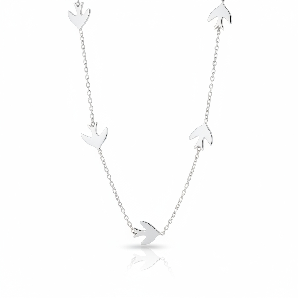 Silver necklace with bird pendants on a white background