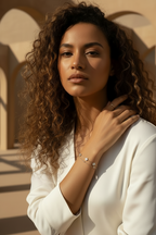 Mini Clover Chain Bracelet fine chain necklace four-leaf clover motif lifestyle shot worn on model against neutral background, ZARIÉ fine jewellery ÉLORA collection