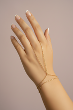 Minimal Bead Handpiece- Gold fine jewellery piece champagne gold-tone on clean white background, product flat lay, ZARIÉ fine jewellery SÉRÉNITÉ collection