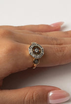 Octave Halo Ring open band ring lifestyle shot worn on model against neutral background, ZARIÉ fine jewellery LUMIÈRE collection