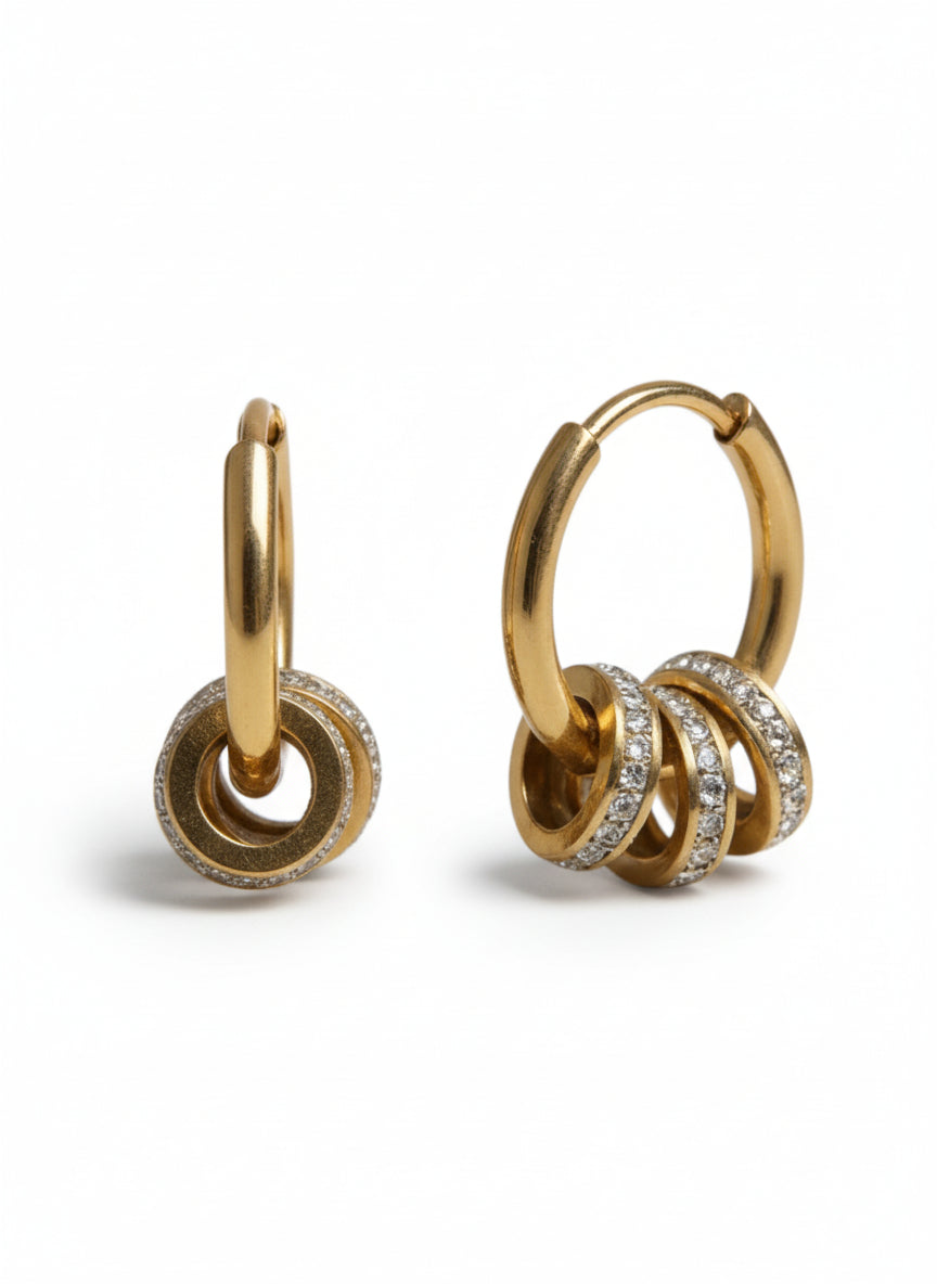 Gold hoop earrings with interlocking rings and small diamonds on a white background
