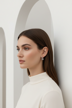 Orbit Charm Hoop Earrings – Silver hoop earrings silver-tone lifestyle shot worn on model against neutral background, ZARIÉ fine jewellery ÉLORA collection