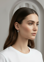 Orbit Charm Hoop Earrings – Silver hoop earrings silver-tone lifestyle shot worn on model against neutral background, ZARIÉ fine jewellery ÉLORA collection