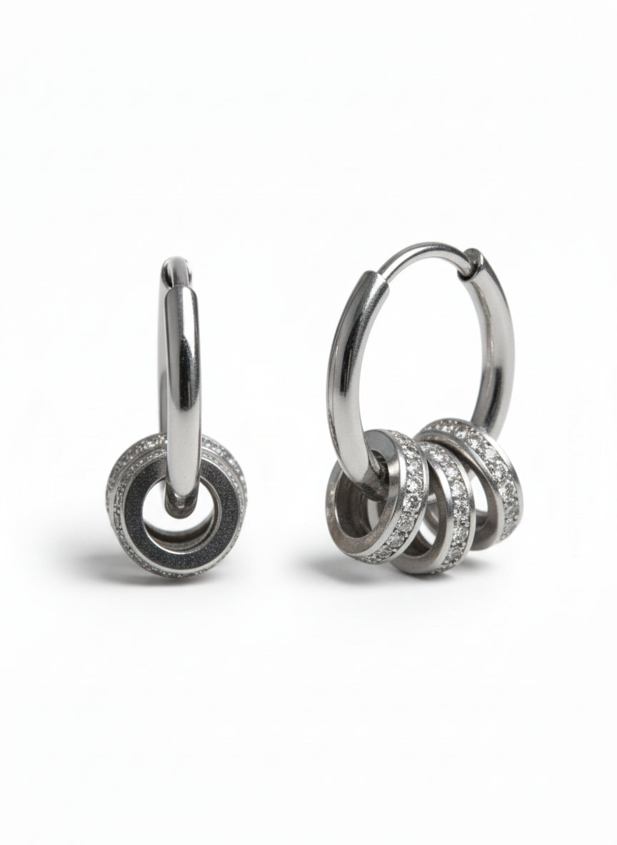 Orbit Charm Hoop Earrings – Silver hoop earrings silver-tone on clean white background, product flat lay, ZARIÉ fine jewellery ÉLORA collection