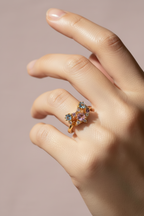 Pastel Facet Open Ring open band ring lifestyle shot worn on model against neutral background, ZARIÉ fine jewellery RAYONNE collection