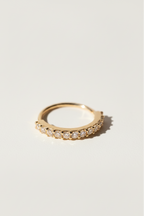 Pavé Arc Nose Ring — Gold open band ring champagne gold-tone with pavé stone setting lifestyle shot worn on model against neutral background, ZARIÉ fine jewellery LUMIÈRE collection