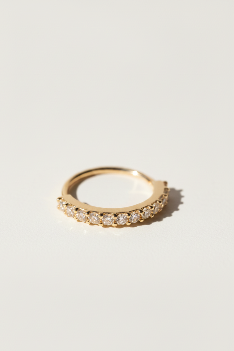 Pavé Arc Nose Ring — Gold open band ring champagne gold-tone with pavé stone setting lifestyle shot worn on model against neutral background, ZARIÉ fine jewellery LUMIÈRE collection