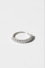 Pavé Arc Nose Ring — Silver open band ring silver-tone with pavé stone setting lifestyle shot worn on model against neutral background, ZARIÉ fine jewellery ÉLORA collection