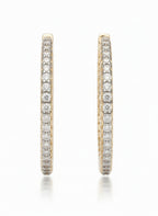 Pavé Lined Hoop Earrings hoop earrings with pavé stone setting lifestyle shot worn on model against neutral background, ZARIÉ fine jewellery LUMIÈRE collection