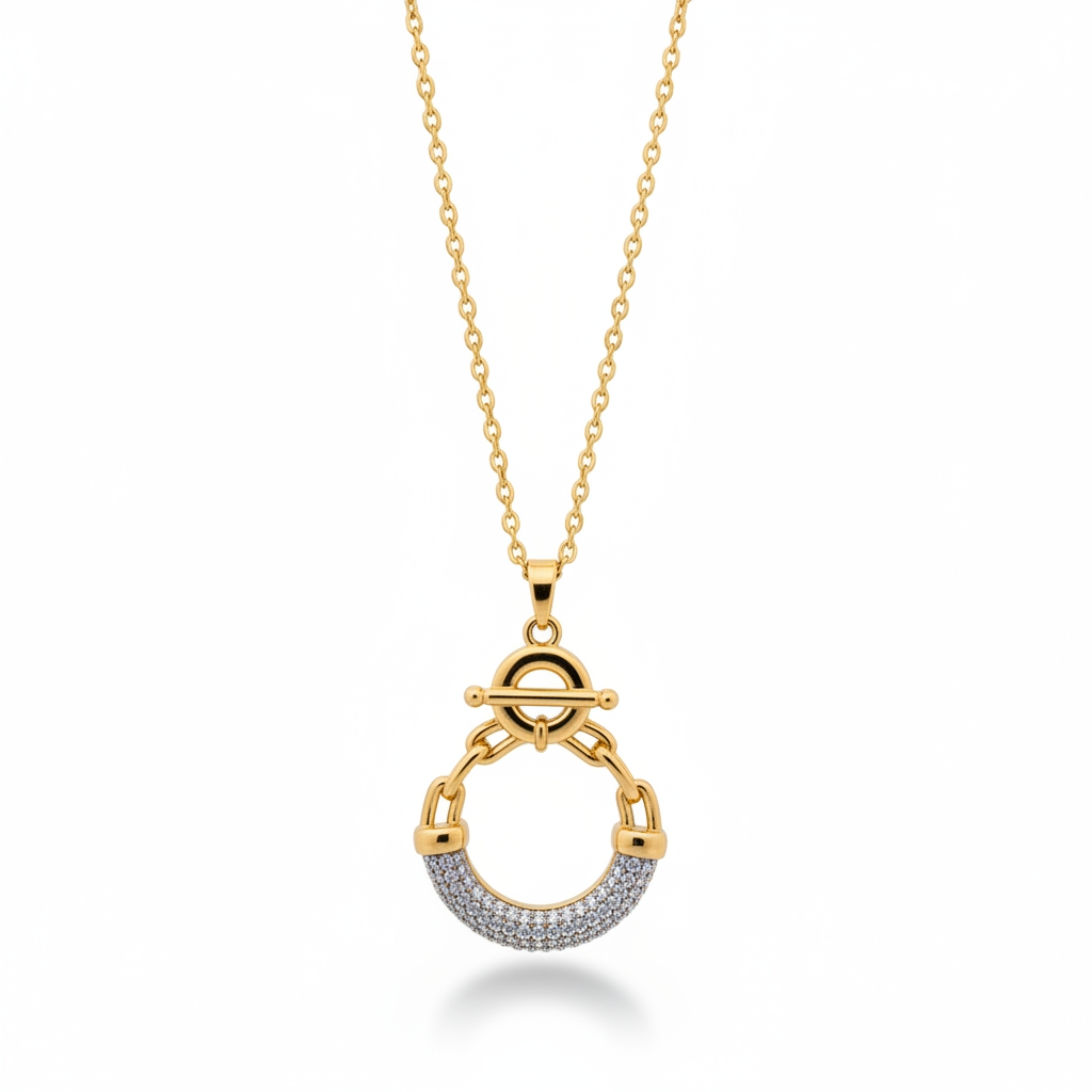Gold necklace with a circular pendant on a white background